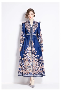 Detail of vintage paisley print on long sleeve V-neck dress with ruffle shoulders