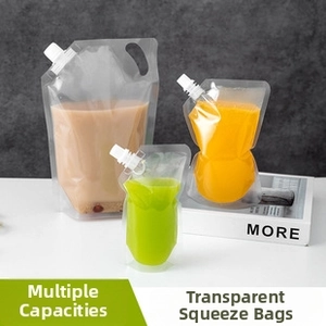 Detail view of transparent spout pouches in various sizes for drinks with easy pour nozzles