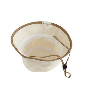 Baby bucket hat with cute bear patch, beige canvas and dark brown trim detail
