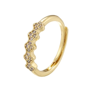 Macro detail of wave-shaped 18K gold-plated ring with shimmering zircon micro-inlays