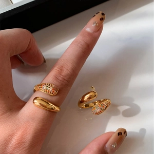 Elegant gold plated spiral open ring featuring a polished sphere and colorful zircon stones
