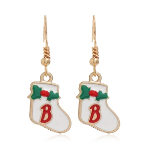 Detail view of red Christmas stocking earrings with golden metal hooks and letter B decoration