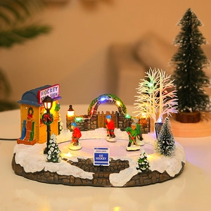 LED lighted musical Christmas snow scene house with hand-painted hockey players and trees
