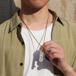 Gold plated hip hop scooter pendant with iced out diamonds on a twisted rope chain
