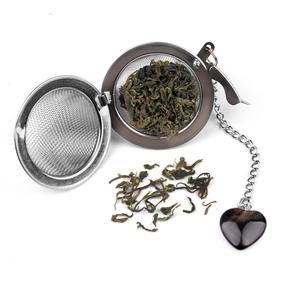 304 stainless steel tea infuser ball with heart-shaped crystal stone charm and loose leaves