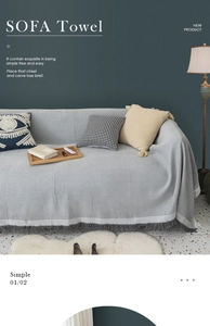 Close-up of grey waffle textured sofa towel with tassel fringe detailing on a modern couch