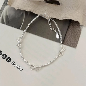 Elegant S925 sterling silver bow charm bracelet with adjustable lobster clasp closure
