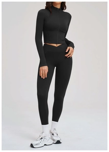 Detail of black long sleeve zipper crop top and V-cross high waist leggings gym set