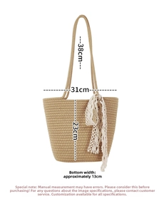 Detail view of woven khaki beach tote with lace bow showing dimensions 31x23x13cm