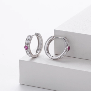 Detail view of S925 silver hoop earrings featuring pink zircon and micro-pave white stones