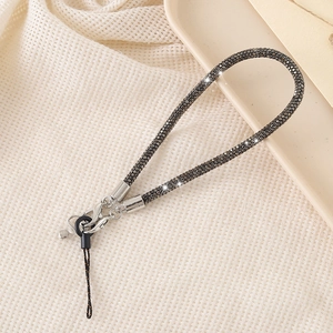 Detail of luxury dark grey rhinestone phone wrist strap with sparkling diamond crystals