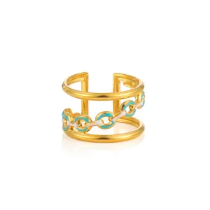 Detail of adjustable gold-plated ring with turquoise enamel and chain link pattern