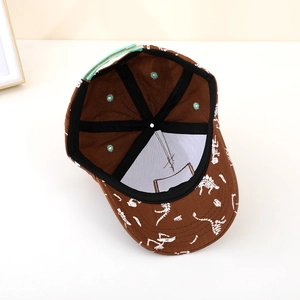 Brown dinosaur print baseball cap interior with mint green strap and black sweatband