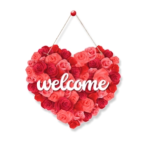 Detail of a heart-shaped welcome sign made with red and pink faux roses for party decor