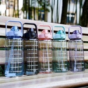 Set of five large 2L sports water bottles in various colors with time markers and straws