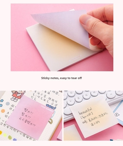 Detailed view of square gradient sticky notes on a desk with handwritten notes