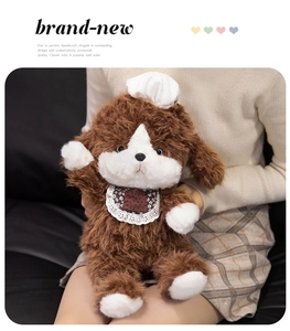 Close-up of a plush puppy wearing a lace bib and hat, showing soft faux fur textures
