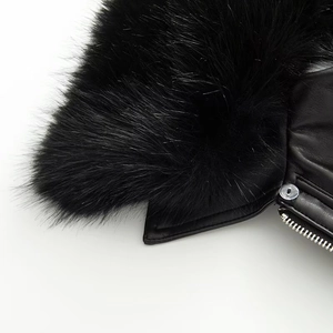 Close-up detail of luxury black leather jacket with detachable faux fur collar
