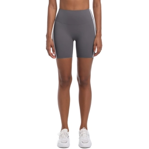 Close-up of grey high-waist yoga shorts with side white stripes and elastic fitness fabric