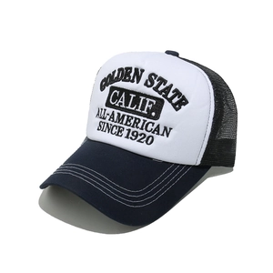 Close-up of 3D embroidery and contrast stitching on a mesh trucker baseball cap