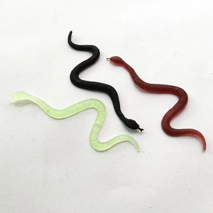 Set of three realistic toy snakes in black, dark red, and light green for Halloween party
