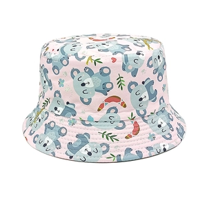Detail of pink cotton sun hat featuring cute cartoon koala and eucalyptus leaf prints