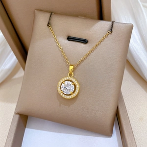 Close-up of gold hollow zircon necklace with sparkling crystals in a jewelry box