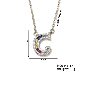 Detail of G letter pendant necklace with colorful gems and size specifications