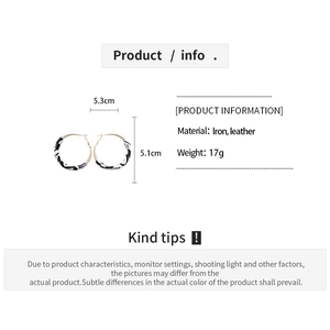 Detail showing dimension and weight of zebra print leather-wrapped hoop earrings