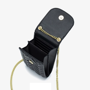 Black quilted leather shoulder bag with gold chain strap and internal card slots