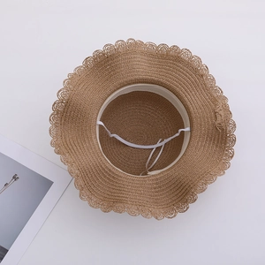 Kids woven straw sun hat with wavy lace trim and elastic wind strap in tan color