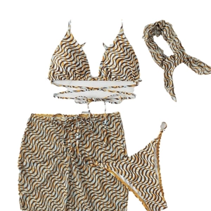 Three-piece bikini set with retro wave pattern including halter top, skirt, and headscarf