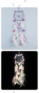 Cat-shaped dreamcatcher detail showing natural light and LED glowing effect with feathers