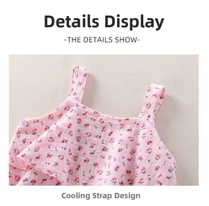 Detail of floral baby girl strap dress showing ruffled layers and breathable cotton fabric