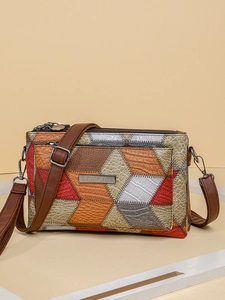 Retro multi-colored leather crossbody bag with brown shoulder strap and metal logo