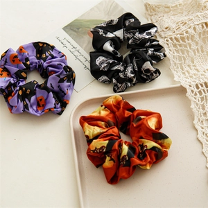 Three-piece Halloween satin scrunchie set with pumpkin and skull prints for women