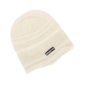 Detail of soft beige mohair knit beanie with fuzzy texture and Blank-viv woven label