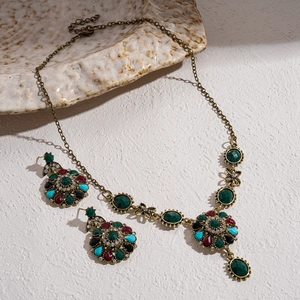 Vintage jewelry set with multi-color rhinestones including necklace and drop earrings