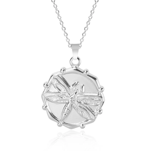 Detailed view of silver dragonfly pendant necklace with bead edge and mirror reflection
