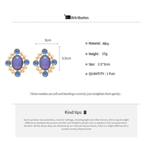 Detail view of retro alloy earrings with blue oval stones and size specifications