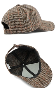 Detail of vintage plaid cotton baseball cap showing metal buckle and inner wash label