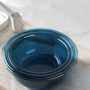 Close-up of deep blue transparent washbasins with stackable space-saving design