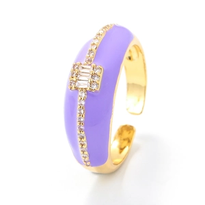 Adjustable gold plated purple enamel ring with geometric zirconia stones on white background