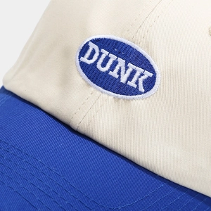Two-tone baseball cap in cream and royal blue with high-quality DUNK embroidery