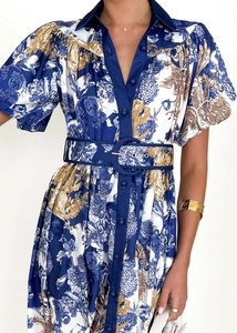 Detailed view of blue floral pattern on premium fabric with matching wide belt and buckle
