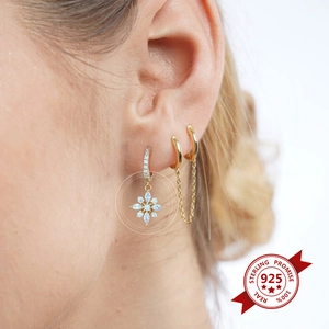 Luxurious gold s925 silver earrings set with sparkling zircon flower and star charms