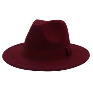 Close-up detail of a classic burgundy wide-brimmed wool felt fedora with ribbon