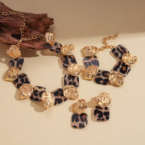 Vintage leopard print resin necklace set with gold geometric shell accents and bracelets