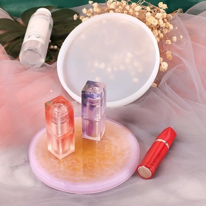 Detail of round silicone resin molds for jewelry tray DIY with a finished coaster