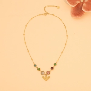 Vintage stainless steel necklace featuring opal beads and a gold angel cupid pendant